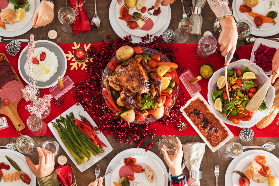 Healthy holiday table with traditional dishes and Christmas decorations
